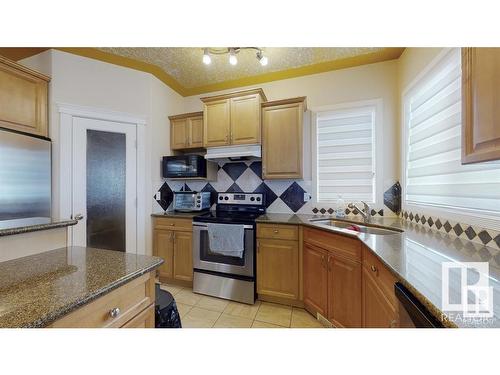 16627 70 Street, Edmonton, AB - Indoor Photo Showing Kitchen With Double Sink