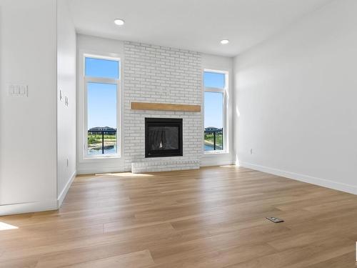 3327 Chickadee Dr, Edmonton, AB - Indoor Photo Showing Living Room With Fireplace