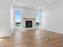 3327 Chickadee Dr, Edmonton, AB  - Indoor Photo Showing Living Room With Fireplace 