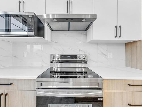 822 Northern Harrier Lane, Edmonton, AB - Indoor Photo Showing Kitchen With Upgraded Kitchen