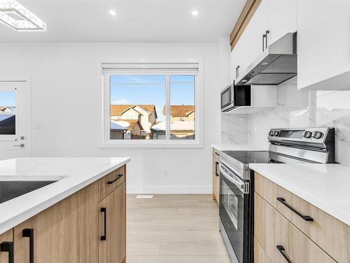 822 Northern Harrier Lane, Edmonton, AB - Indoor Photo Showing Kitchen With Upgraded Kitchen