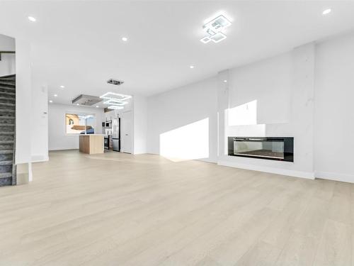 822 Northern Harrier Lane, Edmonton, AB - Indoor Photo Showing Living Room With Fireplace