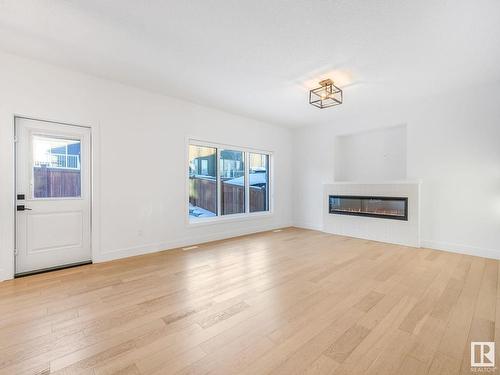 3705 Hummingbird Way, Edmonton, AB - Indoor Photo Showing Living Room With Fireplace