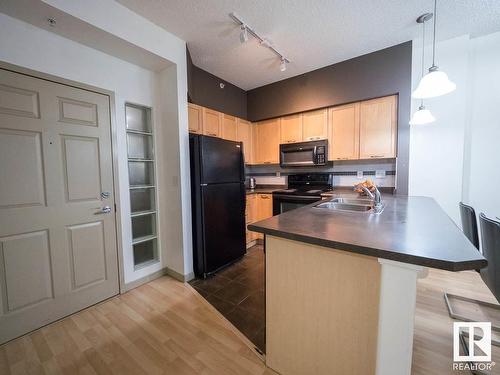 2-116 4245 139 Avenue, Edmonton, AB - Indoor Photo Showing Kitchen With Double Sink