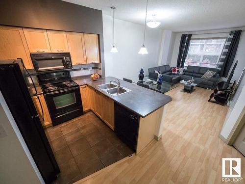 2-116 4245 139 Avenue, Edmonton, AB - Indoor Photo Showing Kitchen With Double Sink