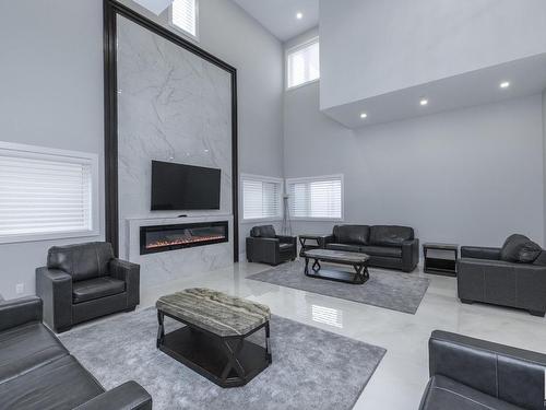 14 3466 Keswick Boulevard, Edmonton, AB - Indoor Photo Showing Living Room With Fireplace