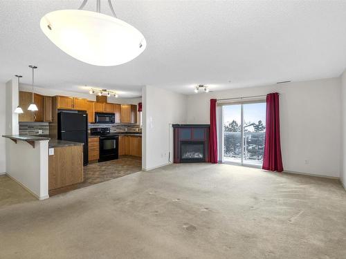 342 16035 132 Street, Edmonton, AB - Indoor Photo Showing Kitchen With Fireplace