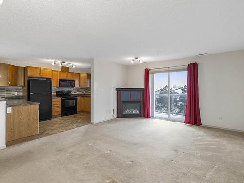 342 16035 132 Street, Edmonton, AB - Indoor Photo Showing Kitchen With Fireplace