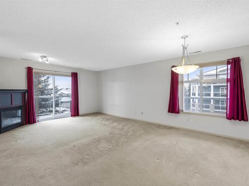 342 16035 132 Street, Edmonton, AB - Indoor Photo Showing Other Room With Fireplace