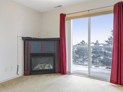 342 16035 132 Street, Edmonton, AB - Indoor Photo Showing Living Room With Fireplace