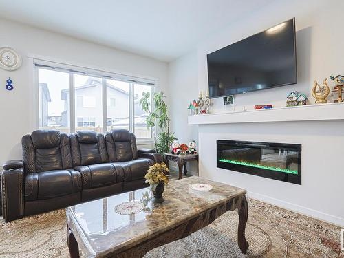 15824 30 Avenue Sw, Edmonton, AB - Indoor Photo Showing Living Room With Fireplace