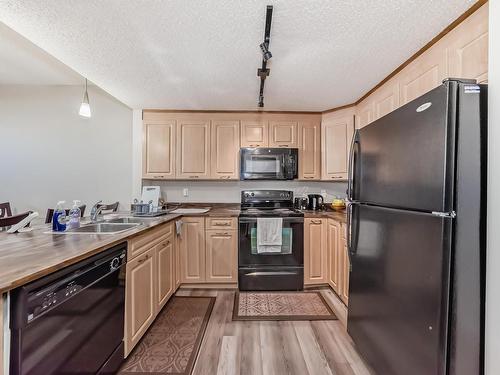 409 6315 135 Avenue, Edmonton, AB - Indoor Photo Showing Kitchen With Double Sink