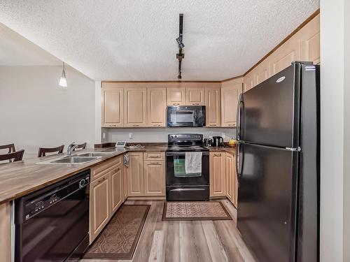 409 6315 135 Avenue, Edmonton, AB - Indoor Photo Showing Kitchen With Double Sink