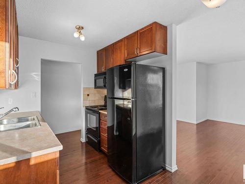 304 9725 82 Avenue, Edmonton, AB - Indoor Photo Showing Kitchen With Double Sink