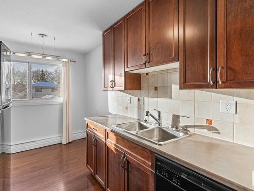 304 9725 82 Avenue, Edmonton, AB - Indoor Photo Showing Kitchen With Double Sink