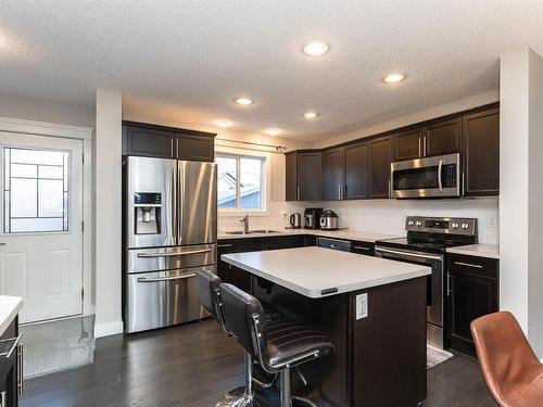 16712 15 Avenue, Edmonton, AB - Indoor Photo Showing Kitchen With Stainless Steel Kitchen With Double Sink