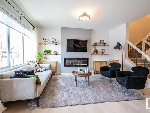 5710 Keeping Crescent, Edmonton, AB - Indoor Photo Showing Living Room With Fireplace