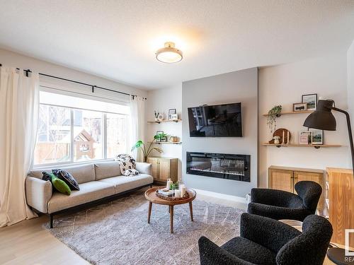 5710 Keeping Crescent, Edmonton, AB - Indoor Photo Showing Living Room With Fireplace