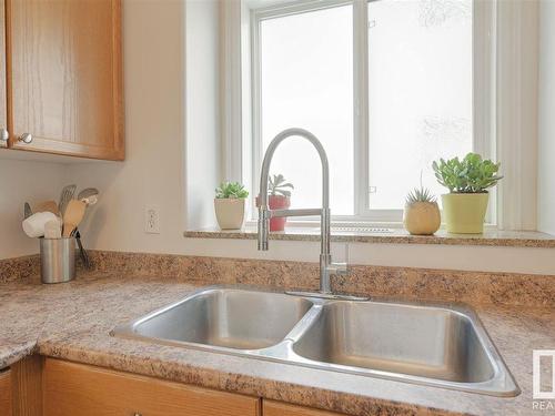 104 10719 80 Avenue Nw, Edmonton, AB - Indoor Photo Showing Kitchen With Double Sink