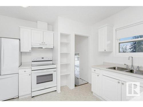 7641 112S Avenue, Edmonton, AB - Indoor Photo Showing Kitchen With Double Sink