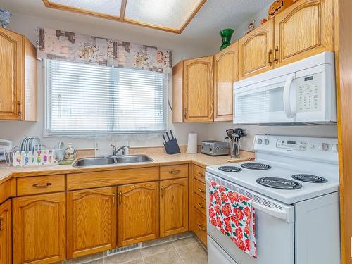 7607 128 Avenue, Edmonton, AB - Indoor Photo Showing Kitchen With Double Sink