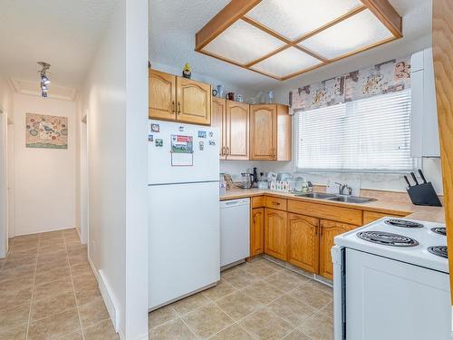 7607 128 Avenue, Edmonton, AB - Indoor Photo Showing Kitchen With Double Sink