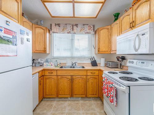 7607 128 Avenue, Edmonton, AB - Indoor Photo Showing Kitchen With Double Sink