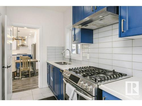 9316 206 Nw, Edmonton, AB - Indoor Photo Showing Kitchen With Stainless Steel Kitchen With Double Sink With Upgraded Kitchen