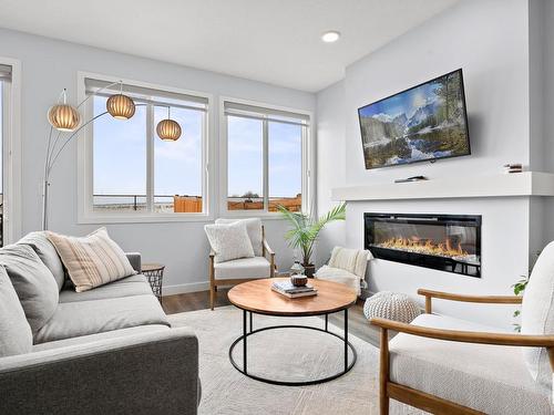 7536 Elmer Bend Bend, Edmonton, AB - Indoor Photo Showing Living Room With Fireplace