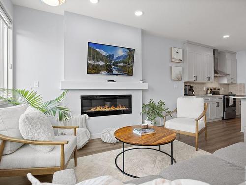 7536 Elmer Bend Bend, Edmonton, AB - Indoor Photo Showing Living Room With Fireplace