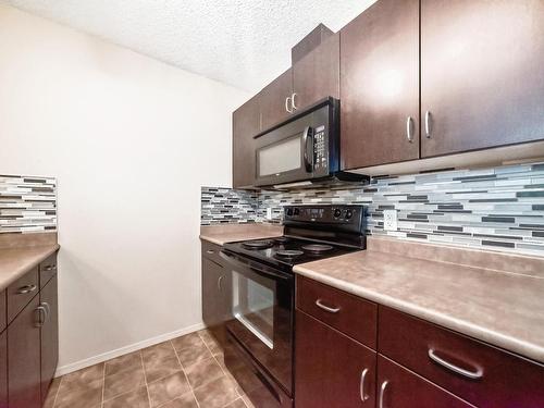 328 1180 Hyndman Road, Edmonton, AB - Indoor Photo Showing Kitchen