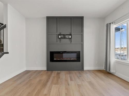 1572 Esaiw Place, Edmonton, AB - Indoor Photo Showing Living Room With Fireplace