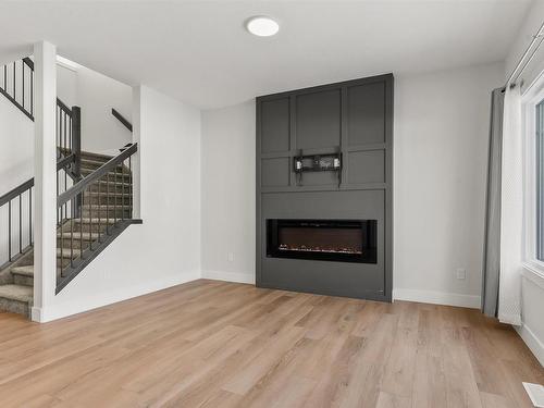 1572 Esaiw Place, Edmonton, AB - Indoor Photo Showing Living Room With Fireplace