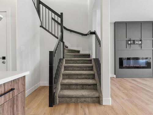 1572 Esaiw Place, Edmonton, AB - Indoor Photo Showing Other Room With Fireplace