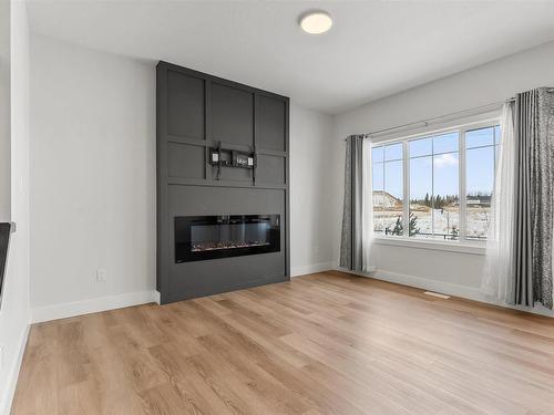 1572 Esaiw Place, Edmonton, AB - Indoor Photo Showing Living Room With Fireplace