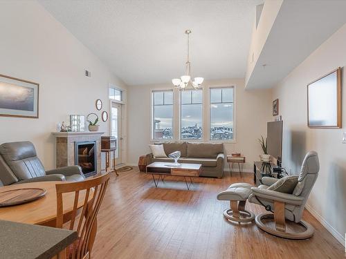 403 4450 Mccrae Avenue, Edmonton, AB - Indoor Photo Showing Living Room With Fireplace