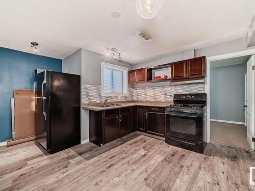 4237 117 Avenue, Edmonton, AB - Indoor Photo Showing Kitchen With Double Sink