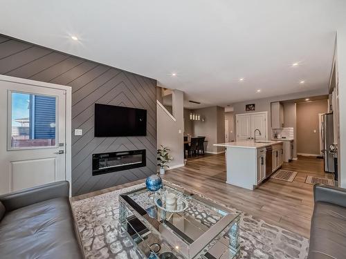 2320 Kelly Circle Circle, Edmonton, AB - Indoor Photo Showing Living Room With Fireplace