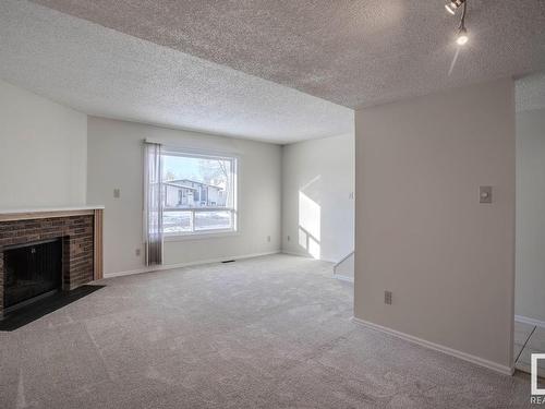 16519 100 Street, Edmonton, AB - Indoor Photo Showing Living Room With Fireplace