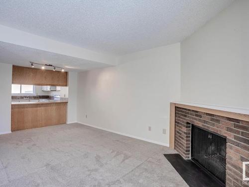 16519 100 Street, Edmonton, AB - Indoor Photo Showing Living Room With Fireplace