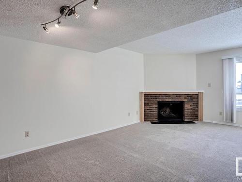 16519 100 Street, Edmonton, AB - Indoor Photo Showing Living Room With Fireplace