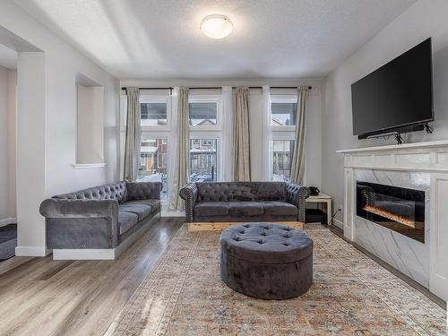 22353 93A Avenue, Edmonton, AB - Indoor Photo Showing Living Room With Fireplace