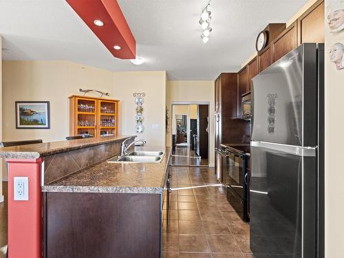 467 11517 Ellerslie Road, Edmonton, AB - Indoor Photo Showing Kitchen With Double Sink