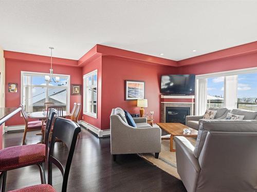 467 11517 Ellerslie Road, Edmonton, AB - Indoor Photo Showing Living Room With Fireplace