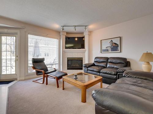 12 882 Ryan Place, Edmonton, AB - Indoor Photo Showing Living Room With Fireplace