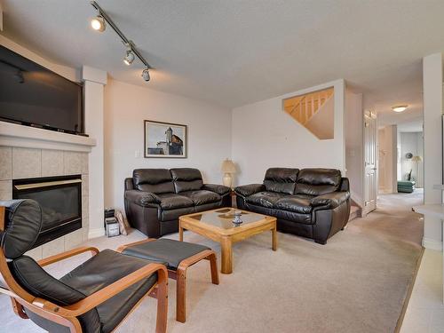 12 882 Ryan Place, Edmonton, AB - Indoor Photo Showing Living Room With Fireplace