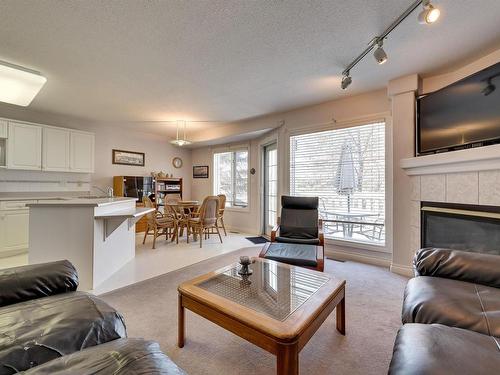 12 882 Ryan Place, Edmonton, AB - Indoor Photo Showing Living Room With Fireplace