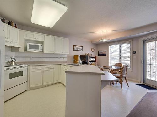 12 882 Ryan Place, Edmonton, AB - Indoor Photo Showing Kitchen With Double Sink