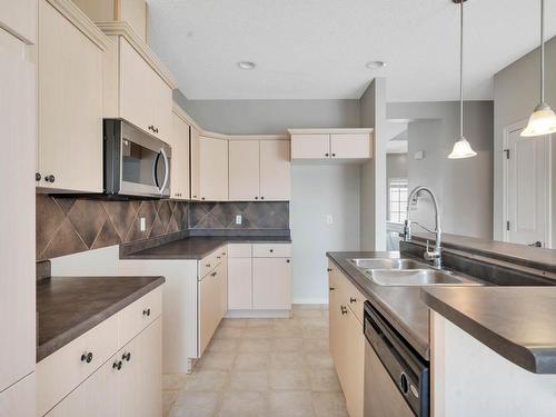 Edmonton, AB - Indoor Photo Showing Kitchen With Double Sink