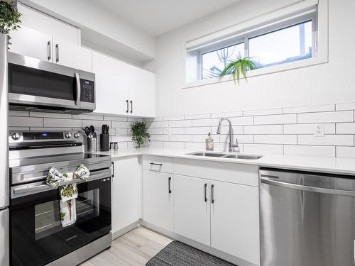 5016 Kinney Link, Edmonton, AB - Indoor Photo Showing Kitchen With Stainless Steel Kitchen With Double Sink